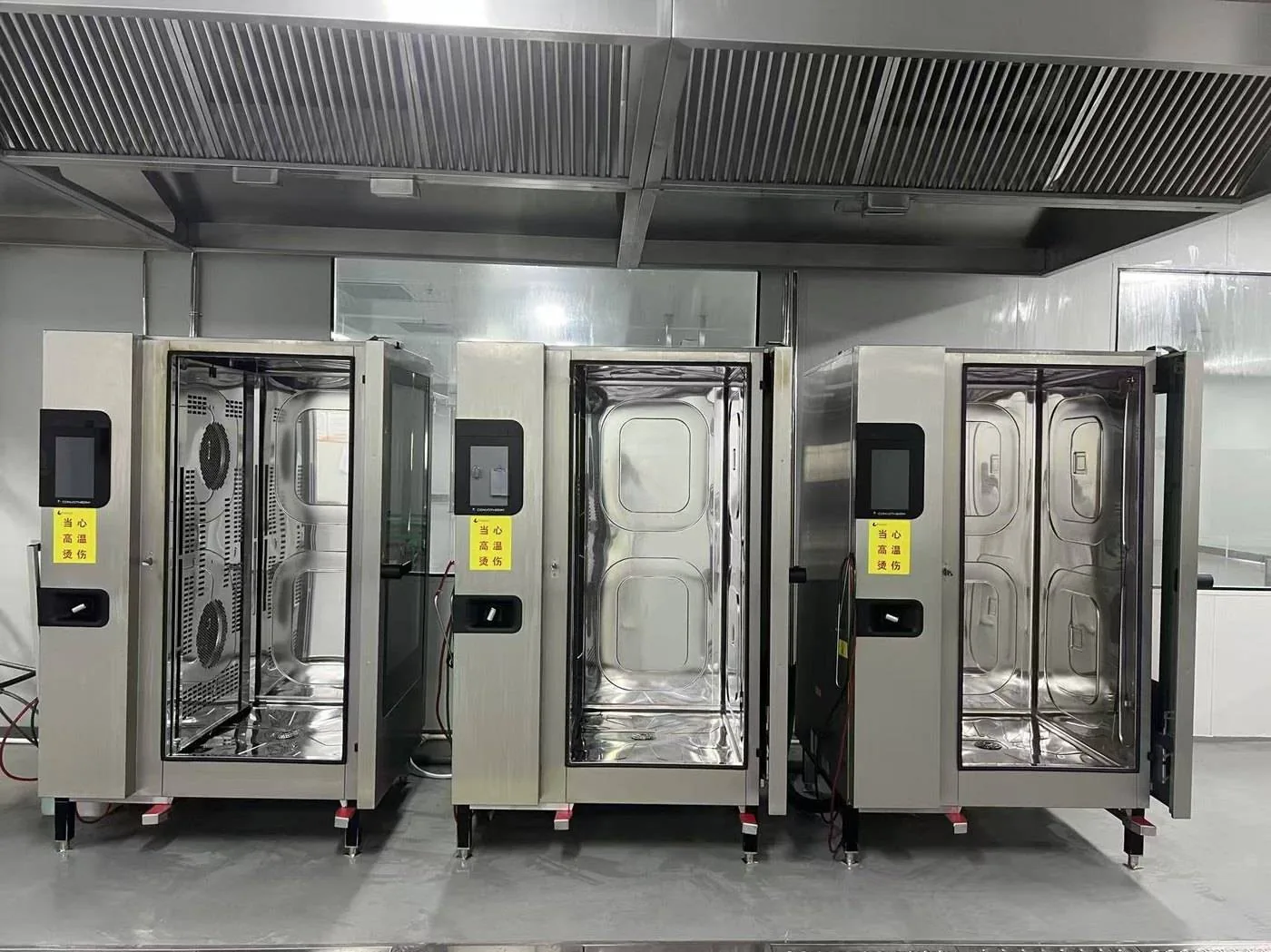 A bank of large Convotherm combi units inside a production plant
