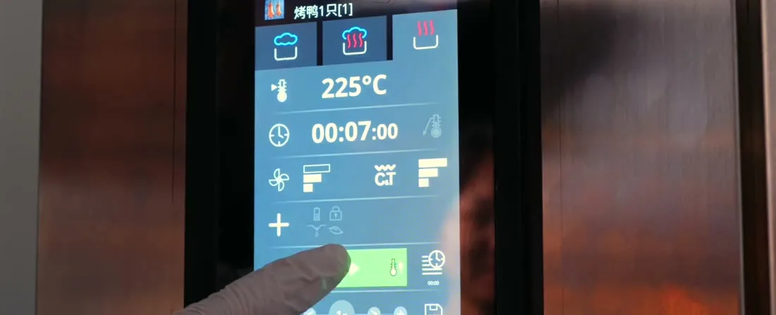 An oven touchscreen showing the roasting program